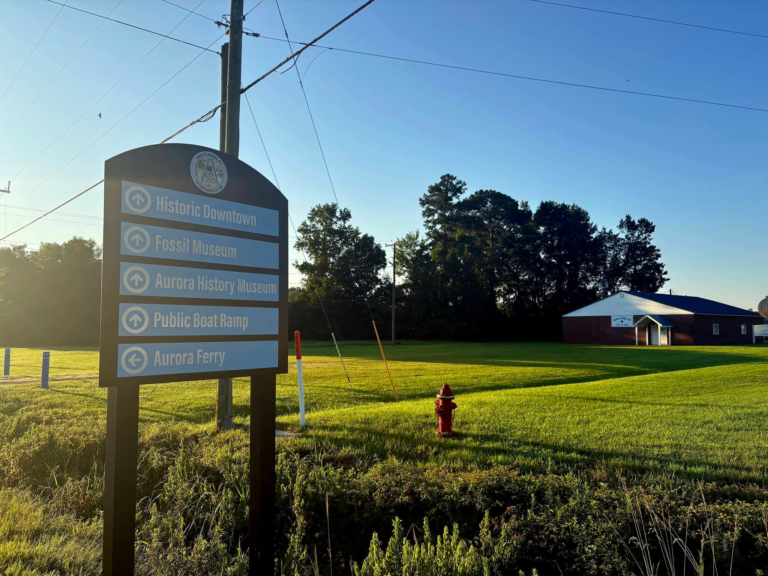New Aurora wayfinding sign directing visitors to Historic Downtown, the Fossil Museum, Aurora History Museum, public boat ramp and Aurora Ferry.